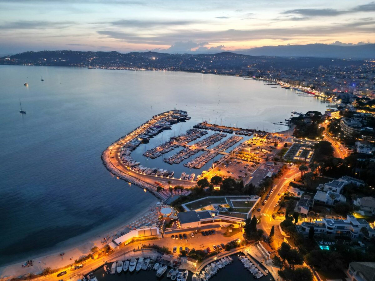 Cannes Film Festival 2026 Travel Guide: Getting Around Cannes During the Event 2 an aerial view of a marina at night