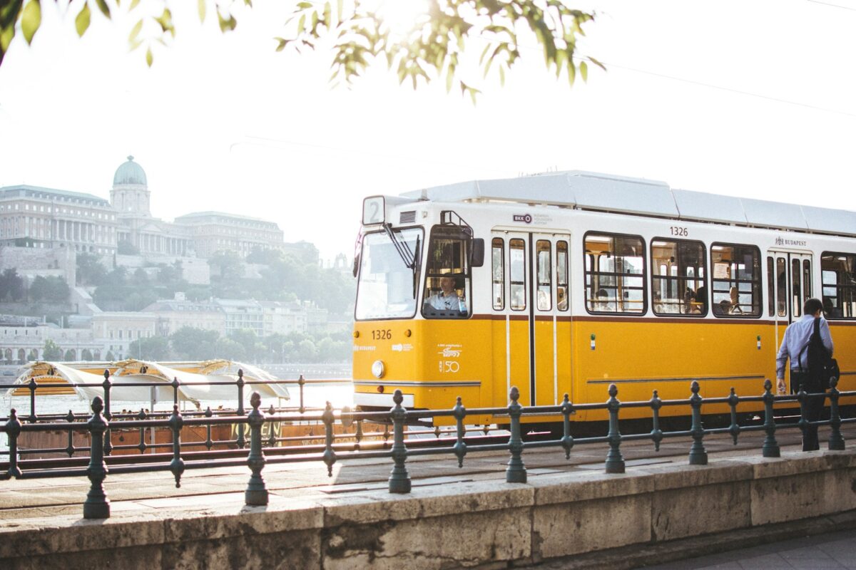 Champions League Final 2026 : the Ultimate Travel Guide 2 man standing in front of yellow train
