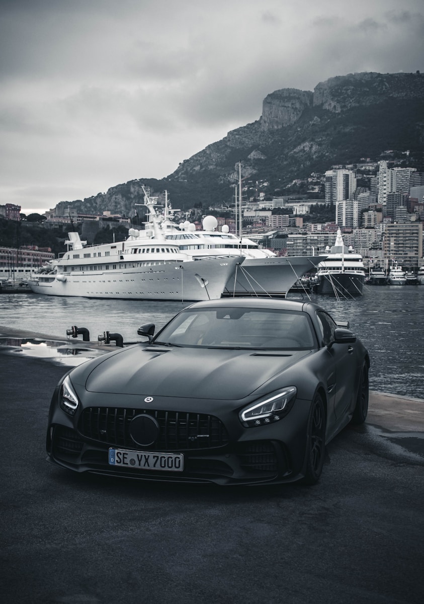 Monaco Yacht Show 2026 Travel Guide: Transport Between Marinas, Hotels, airports & Events 4 black porsche 911 parked on dock during daytime